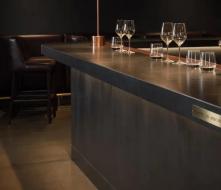 Burnished copper bar and moody interior at Acean Dashgrill